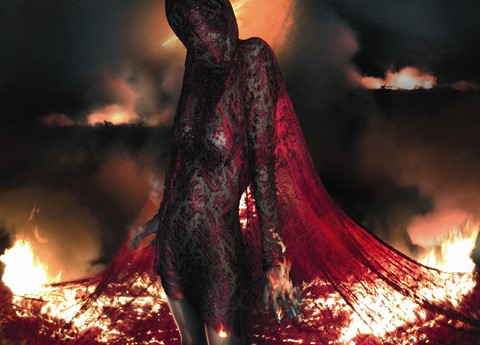 Aymeline wears lace dress and head mask Joan A/W98