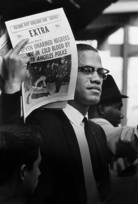 Malcolm C Holding Up Black Muslim Newspaper Chicag