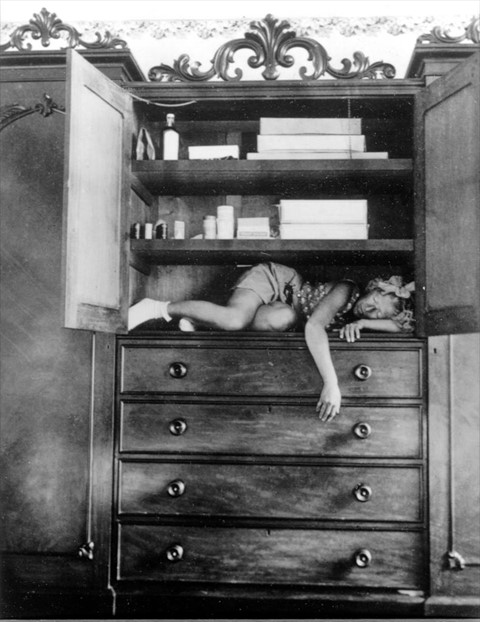 Claude Cahun, Self portrait (in cupboard), c. 1932