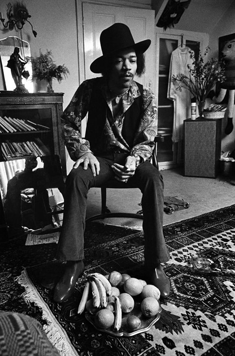 Jimi Hendrix in the bedroom of his flat at 23 Brook Street, 
