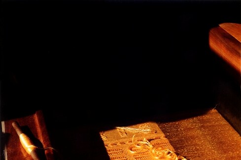 Weaving on loom showing the natural golden colour of the spi