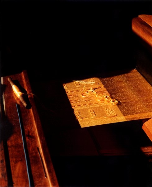 Weaving on loom showing the natural golden colour of the spi