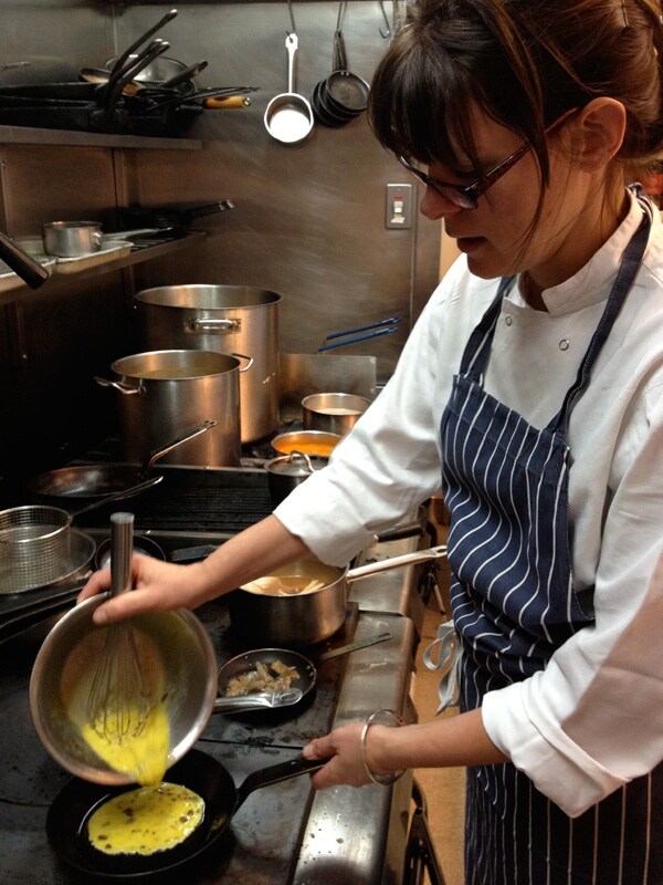 Anna pouring the omelette mix into the pan