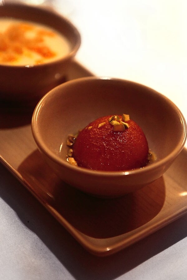 Gulal jamun (dipped fried dumpling dessert)