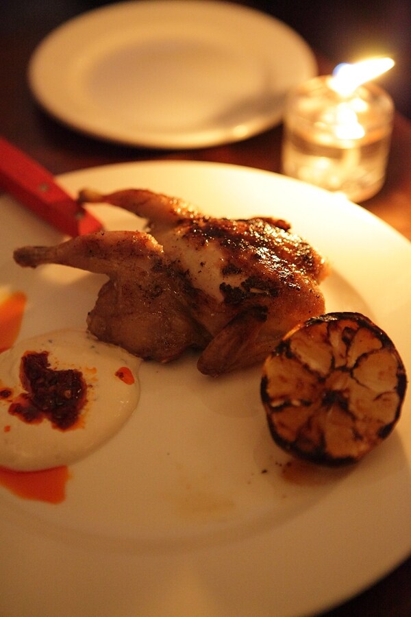 Grilled quail with burnt lemon, tahini-yoghurt and rose hari