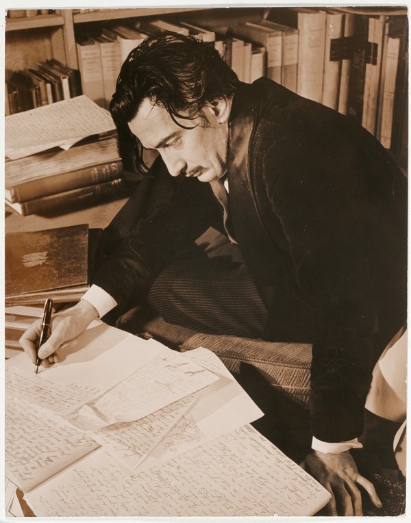 Salvador Dali writing “The secret life of Salvador Dali” at 