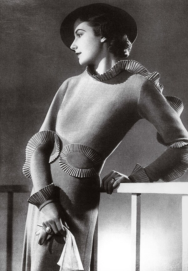 An intricately pleated knit dress by costume designer Joe St