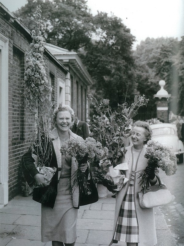 Visitors leaving the Chelsea Flower Show with their purchase