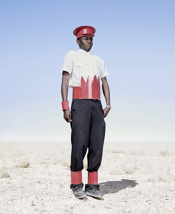 Herero cadet in cardboard hat