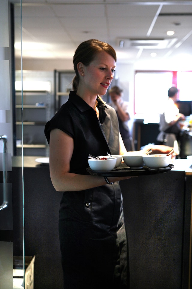 Serving staff in uniforms courtesy of 80s Joseph and Giles D