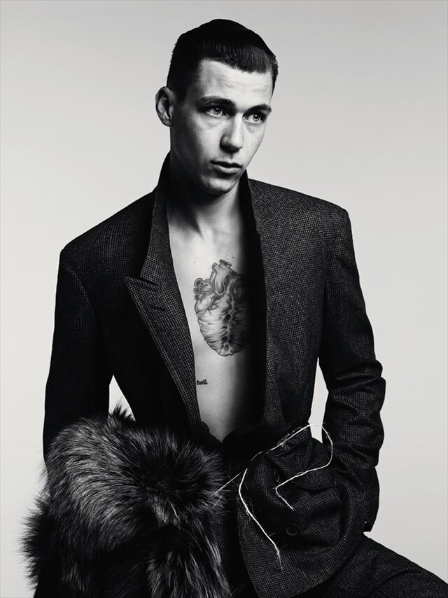 Double-breasted suit by Lanvin; Fur scarf by A.F. Vandevorst