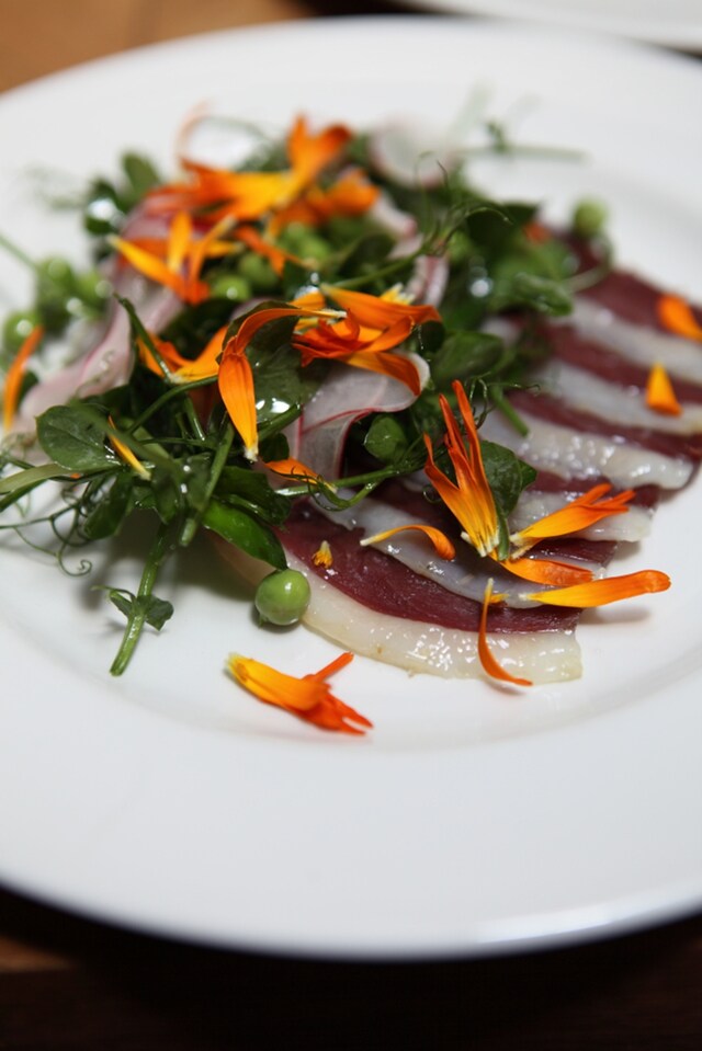Duck ham, radishes and peas