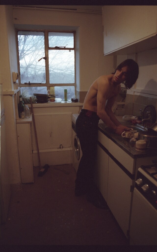 George Clements at kitchen sink