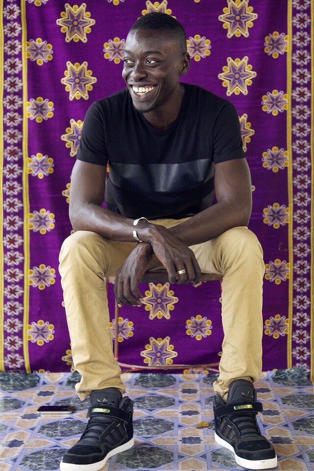 Omar Viktor Diop sitting in one of his sets