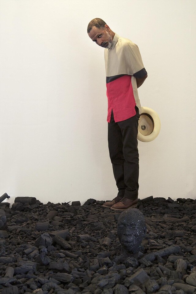 Radcliffe Bailey standing in his piece entitled Storm at Sea