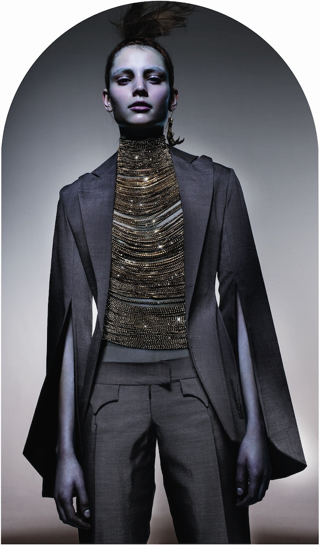 Romy wears suit with slashed sleeves Hunger S/S96