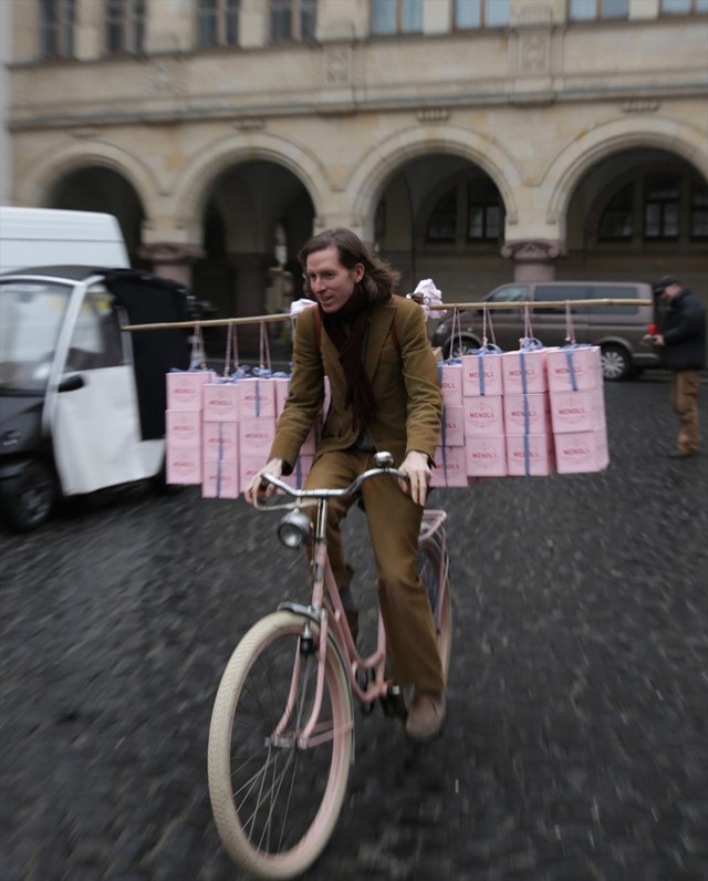 Wes Anderson going for a spin on Agatha’s pink bicycle