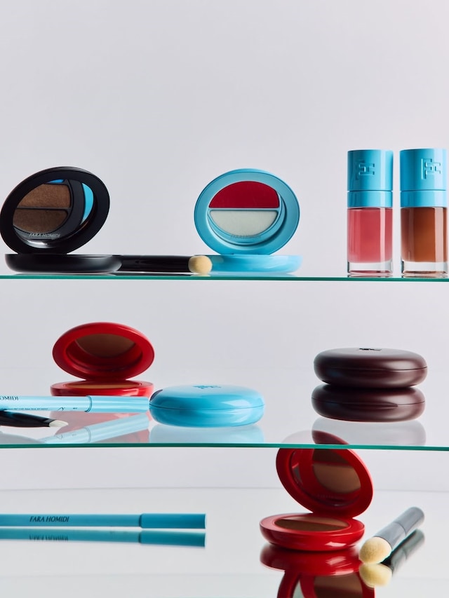 Bathroom shelves full of Fara Homidi make-up products