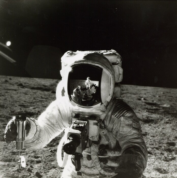 Alan Bean by Pete Conrad, with the reflection of the photogr