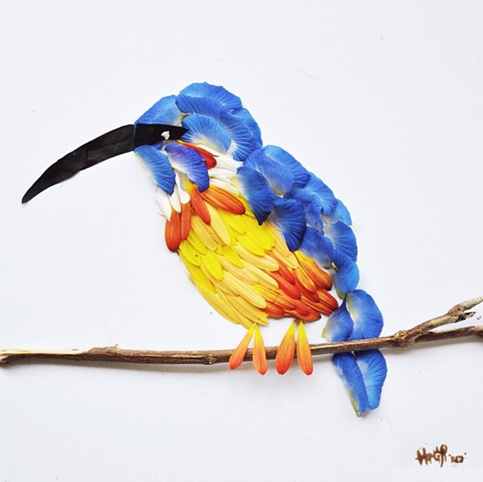 Kingfisher made from gerberas, butterfly peas and purple sha