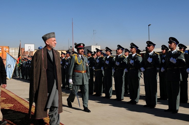 President Hamid Karzai walks down the carpet as he is welcom