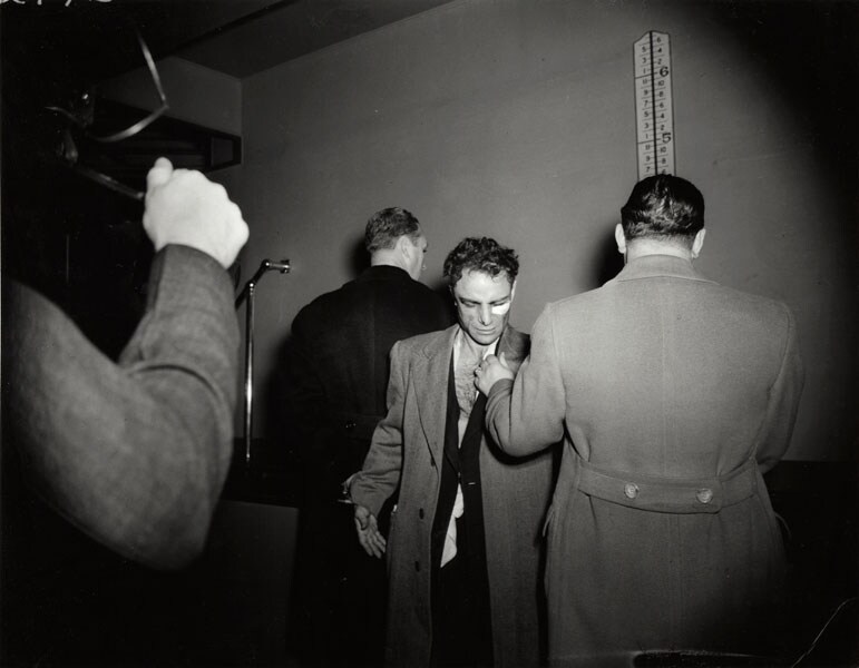 Weegee, [Anthony Esposito, booked on suspicion of killing a 