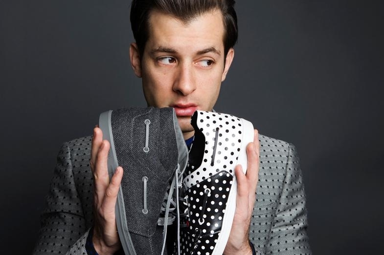 Mark Ronson with a pair of sneakers he designed for Gucci