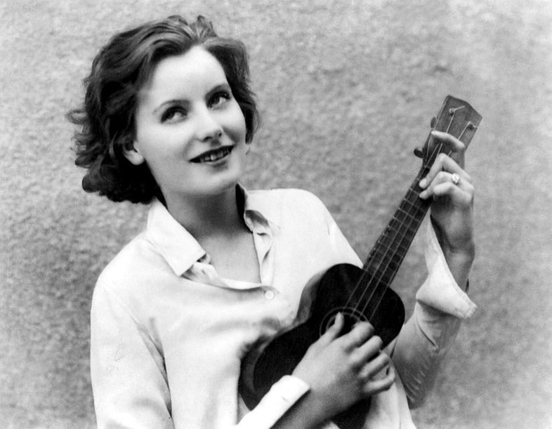 Greta Garbo playing the ukulele
