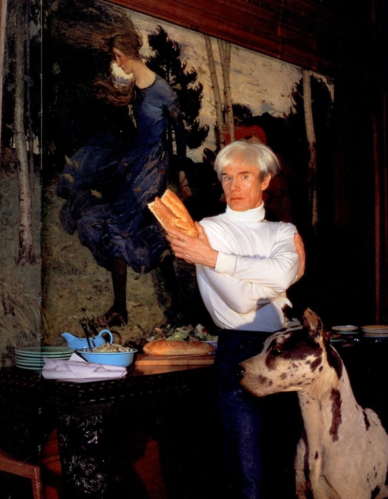 Warhol in his panelled boardroom at the Factory serving cold