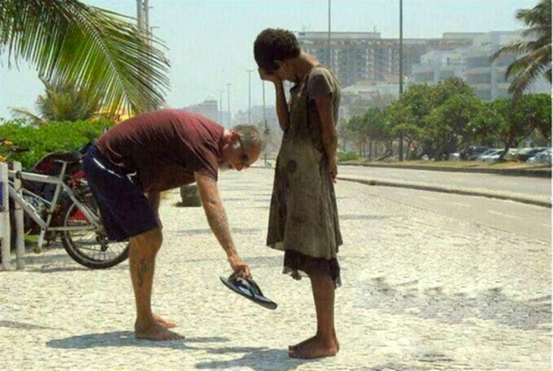 A man gives away his shoes
