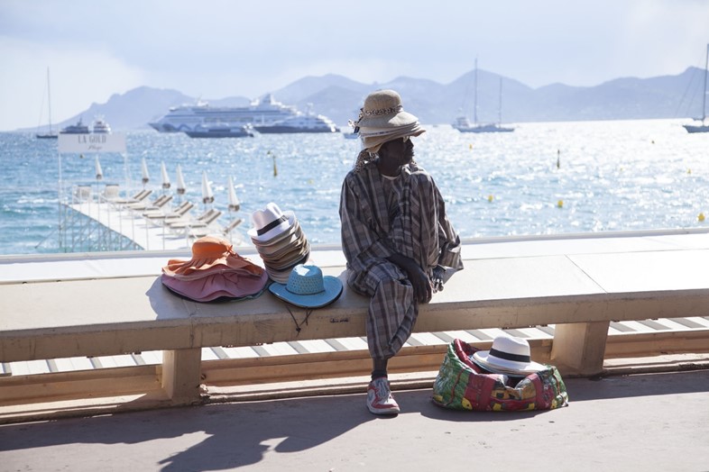 Hat seller on the beachfront