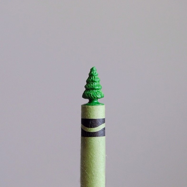 Green crayon tree carved with a sewing needle