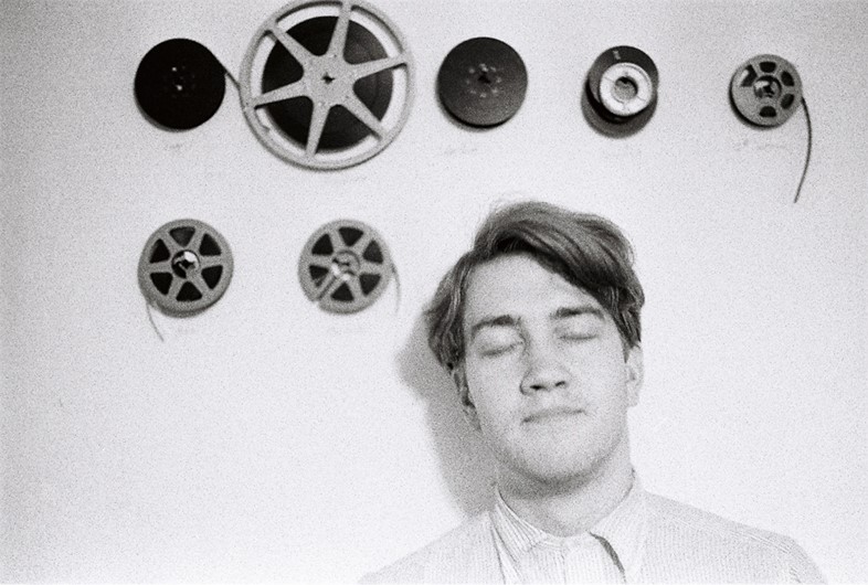 David Lynch with film reels, ca. 1966-70