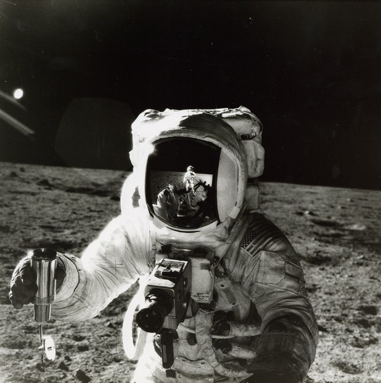 Alan Bean by Pete Conrad, with the reflection of the photogr