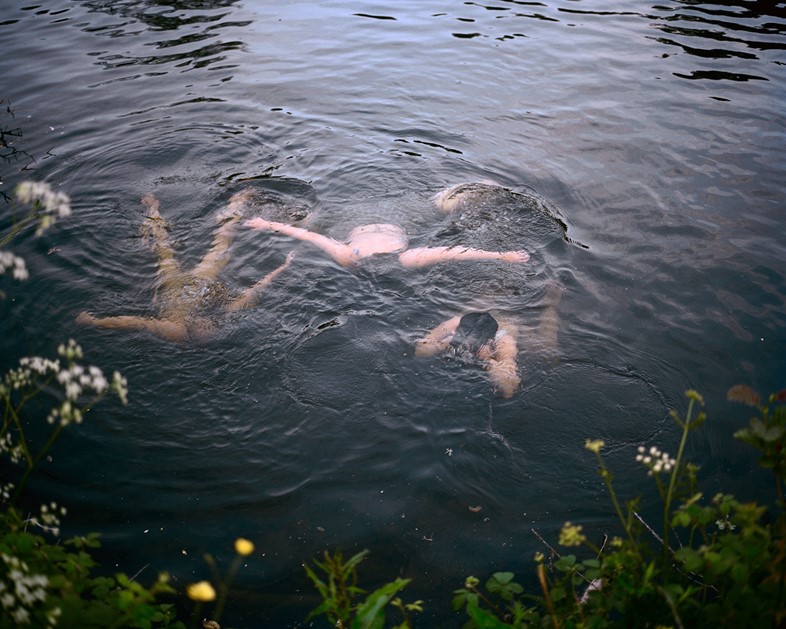 Girls-swimming-at-dusk.-