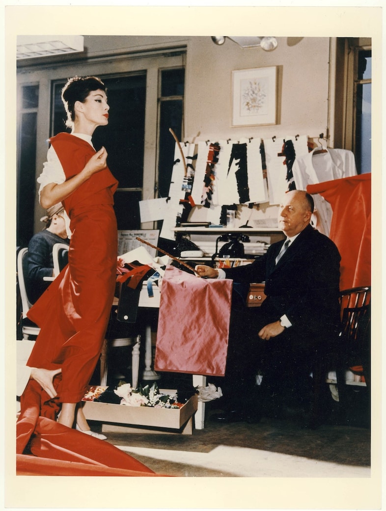 Christian Dior with model Lucky, circa 1955. Court