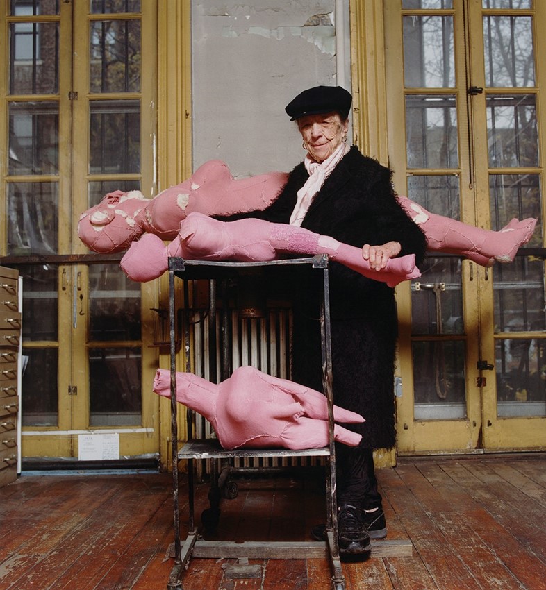 3. Louise Bourgeois with her sculpture, THREE HORI