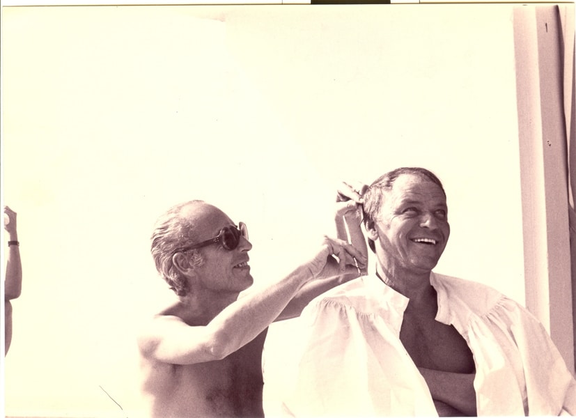 The Marquis of Arcangues gives Frank Sinatra a haircut at th