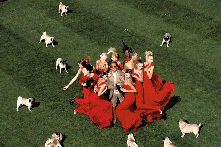 Valentino surrounded by models and pugs, by Jean Paul Goude 