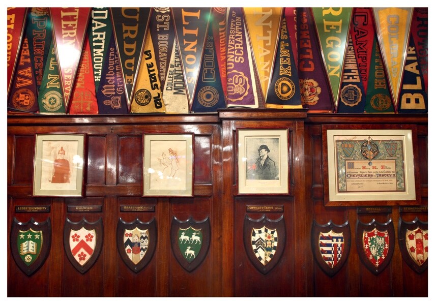 Caricatures and college shields at Harry&#39;s