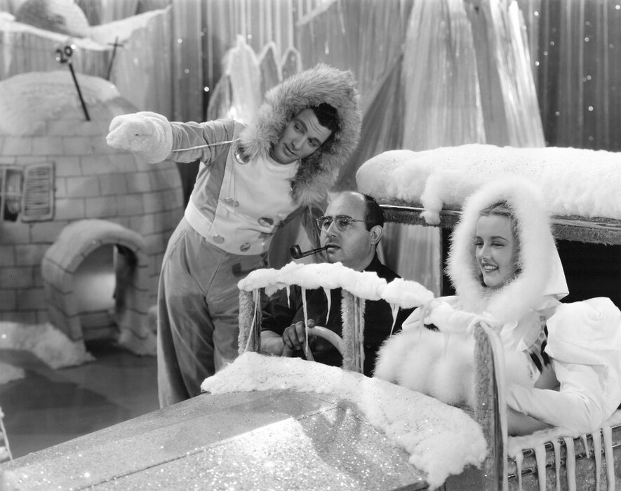 Director Norman Taurog with Tony Martin and Phyllis Brooks o
