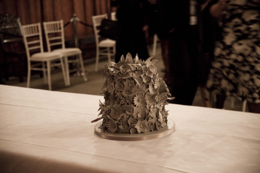 Wedding cake with icing flowers matching the dress and rainb