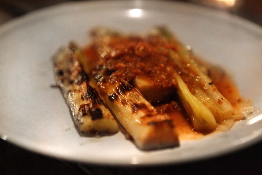 Grilled leeks with dried scallops and bacon in XO sauce