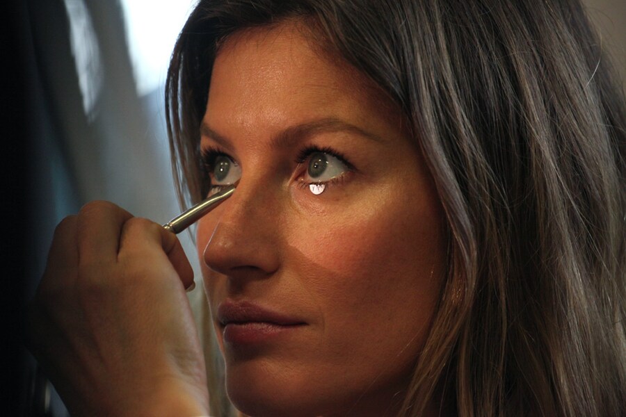 Gisele backstage at Givenchy S/S12