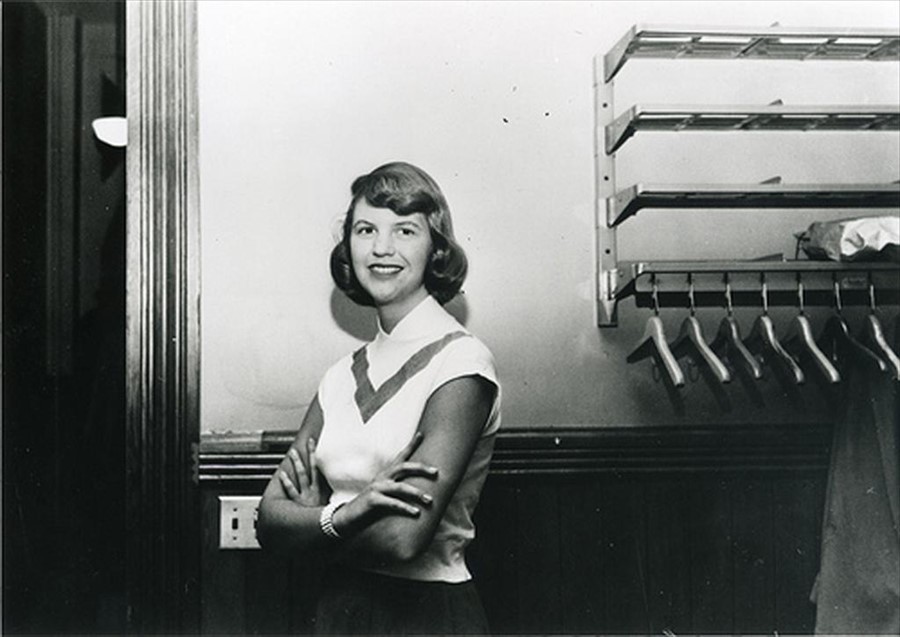Sylvia Plath standing in a hallway , Smith College, 1952 - 1