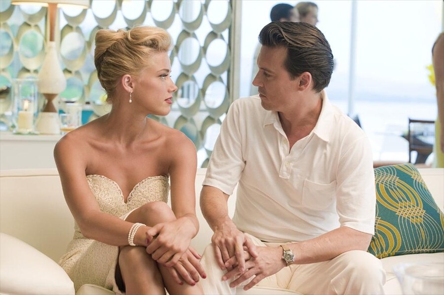 Johnny Depp (Paul Kemp) and Amber Heard (Chenault), The Rum 