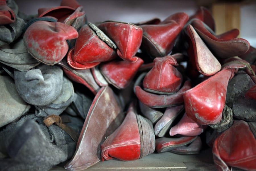 Stacks upon stacks of shoes in long and massive storage faci