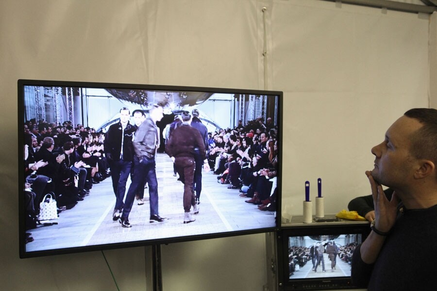 Kim Jones watching Louis Vuitton A/W12 show backstage