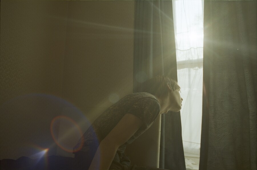 George Clements looking through window