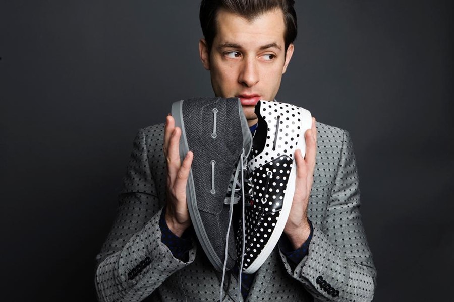 Mark Ronson with a pair of sneakers he designed for Gucci